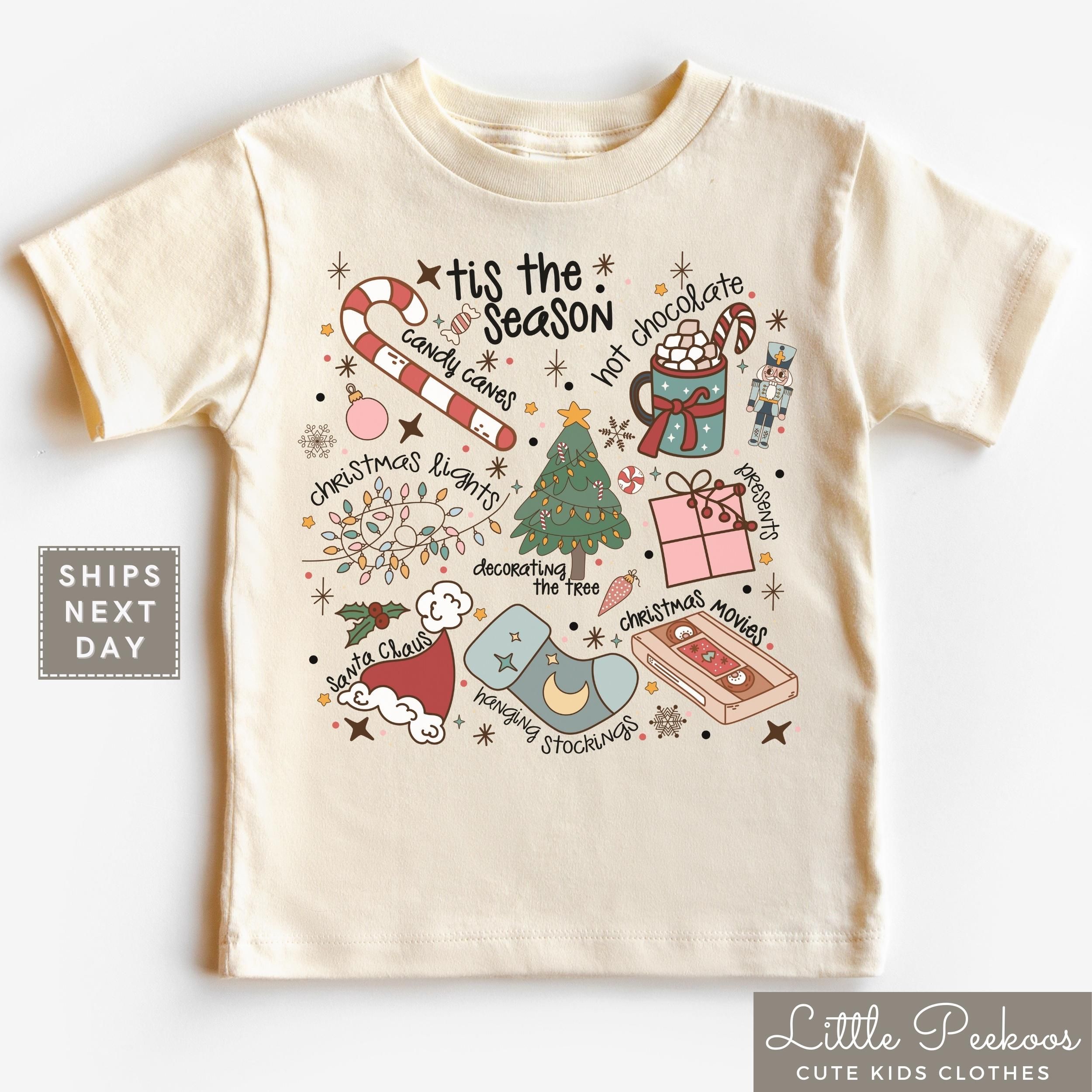 Retro Tis the Season Natural Toddler Shirt, Trendy Christmas Elements Collage Baby Tee - Candy Canes Christmas Movies Kids Holiday Shirt